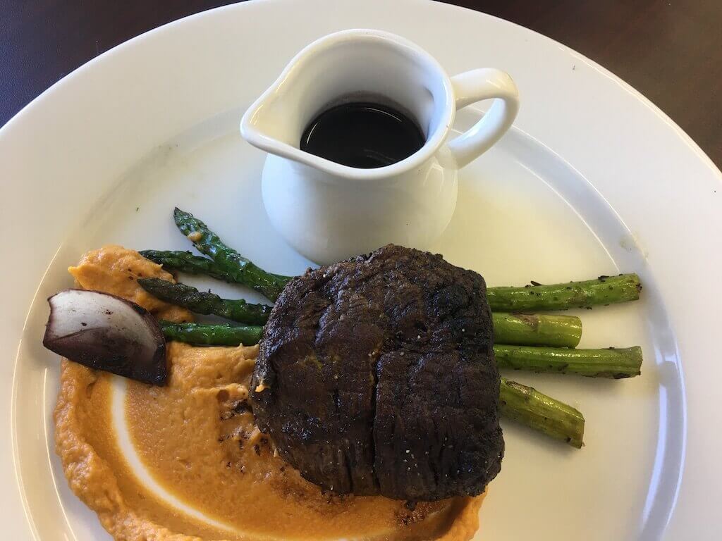 Herbal Beef Filet, Sweet Potatoes, Grilled Asparagus and Shallots in a Merlot Sauce