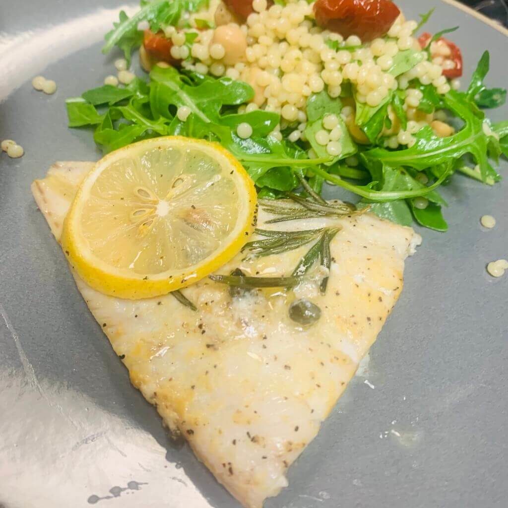Baked Haddock with Israeli Couscous, Arugula, dried Tomatoes, Chickpeas and Feta Cheese (vegetarian-pescatarian, contains dairy